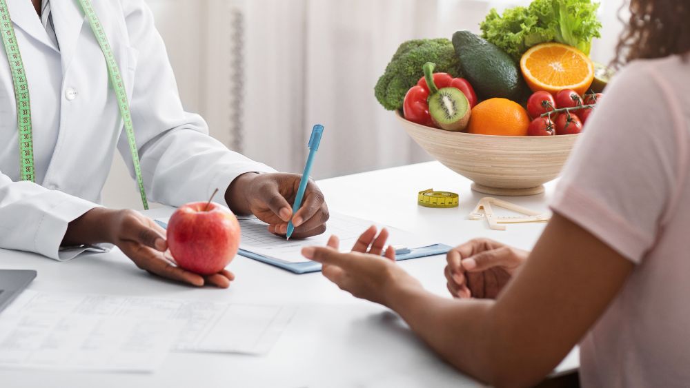 Doctor Discussing Food Allergies With A Pregnant Woman - DR. PRIYANKUR ROY Blog